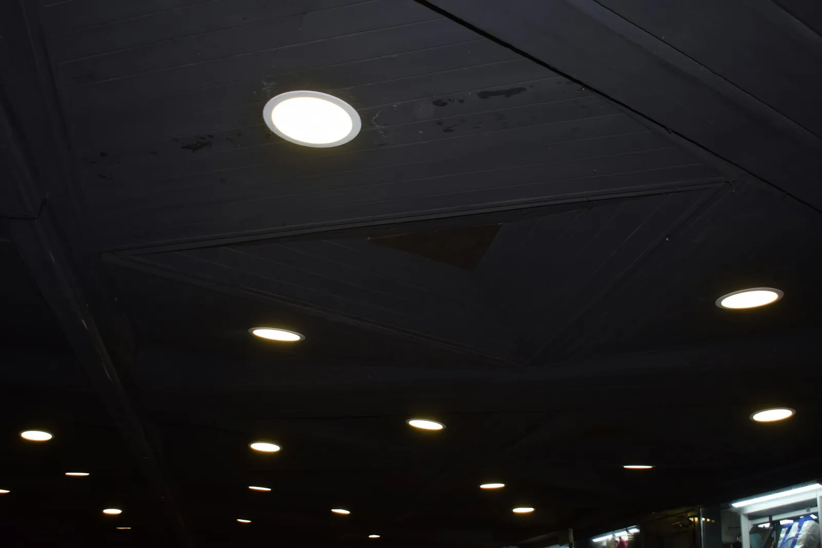 Recessed downlights glowing in a ceiling
